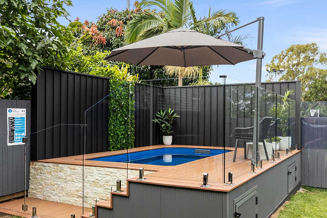 Instant pool in the Whitsundays with a raised deck and pool fencing